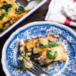slice of parmigiana bianca on a blue plate.