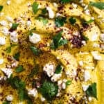 Close-up of turmeric Baba Ganoush with Feta and Sumac