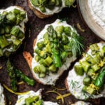 asparagus, burrata and goat's cheese crostini on an iron tray