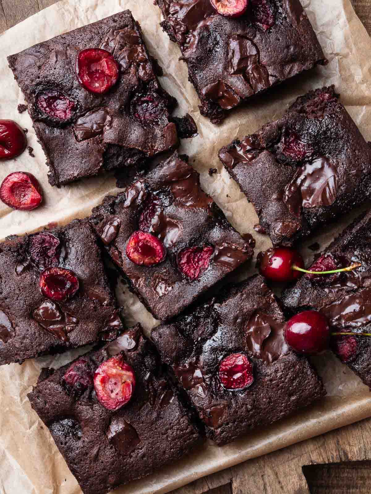 baked cherry chocolate brownies cut in squares.
