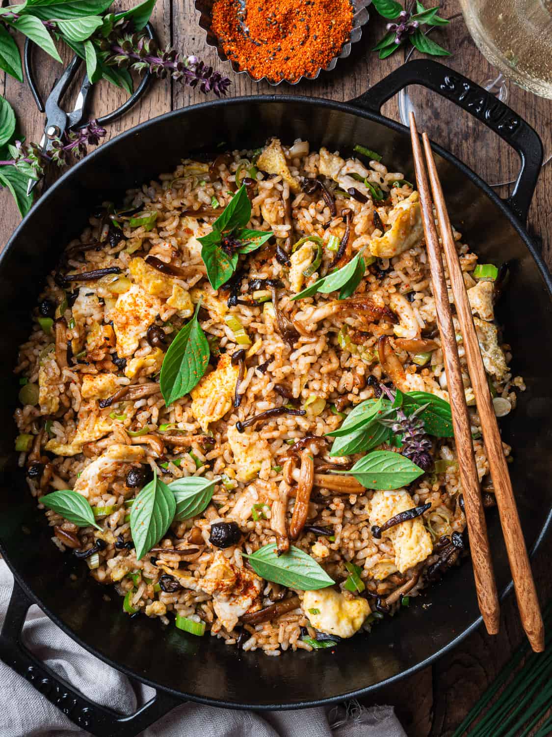 Hibachi Fried Rice in a cast iron pan with chopsticks
