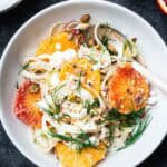 fennel salad with orange slices in a white bowl.