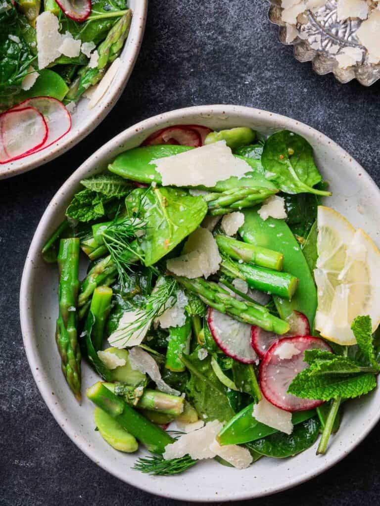 two bowls of spring salad with mint-lemon dressing.