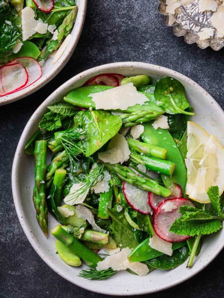 two bowls of spring salad with mint-lemon dressing.