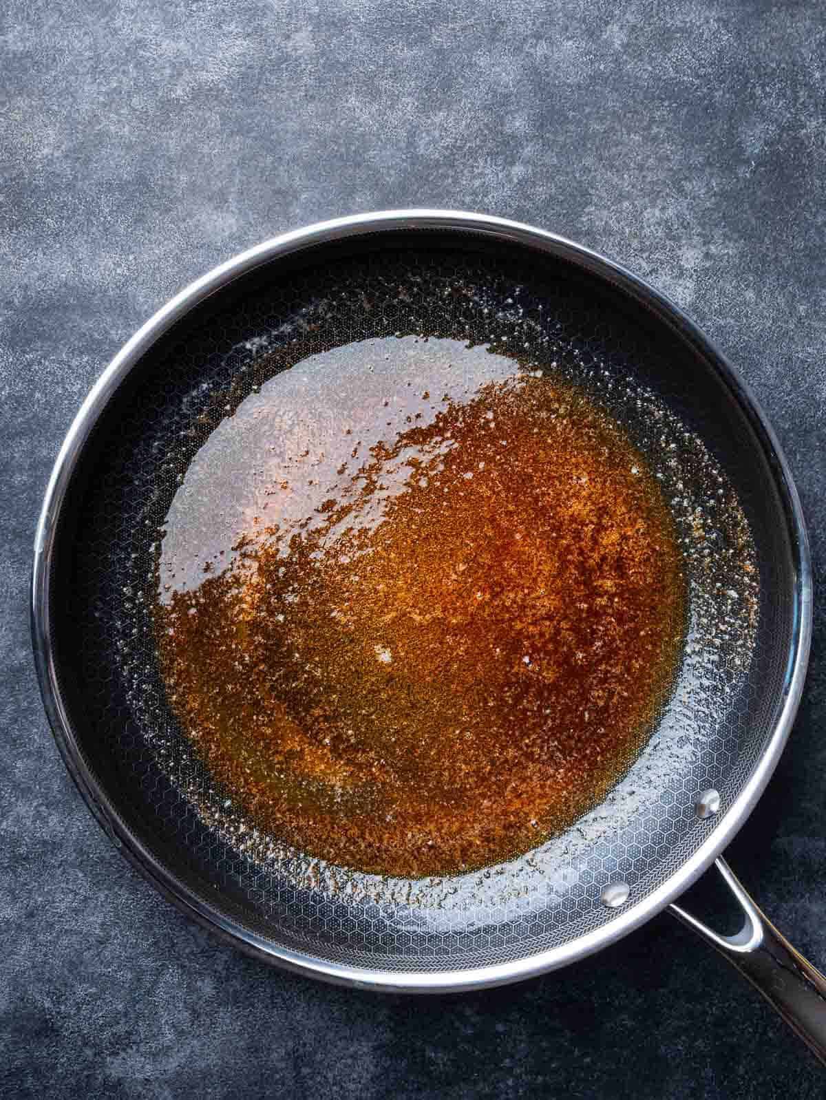 melted butter and smoked paprika in a pan.