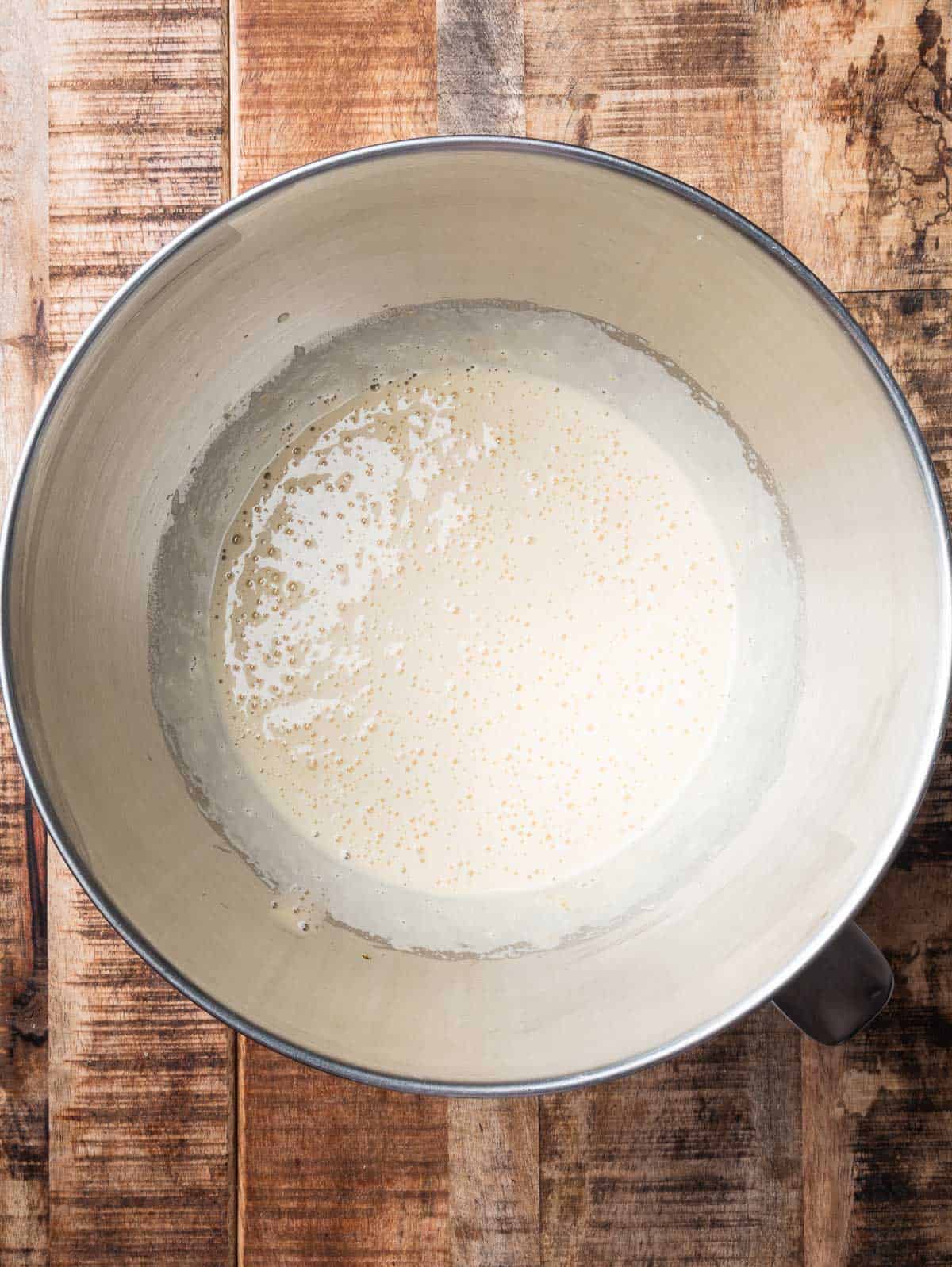 white and foamy sugar and egg mixture in a mixing bowl.