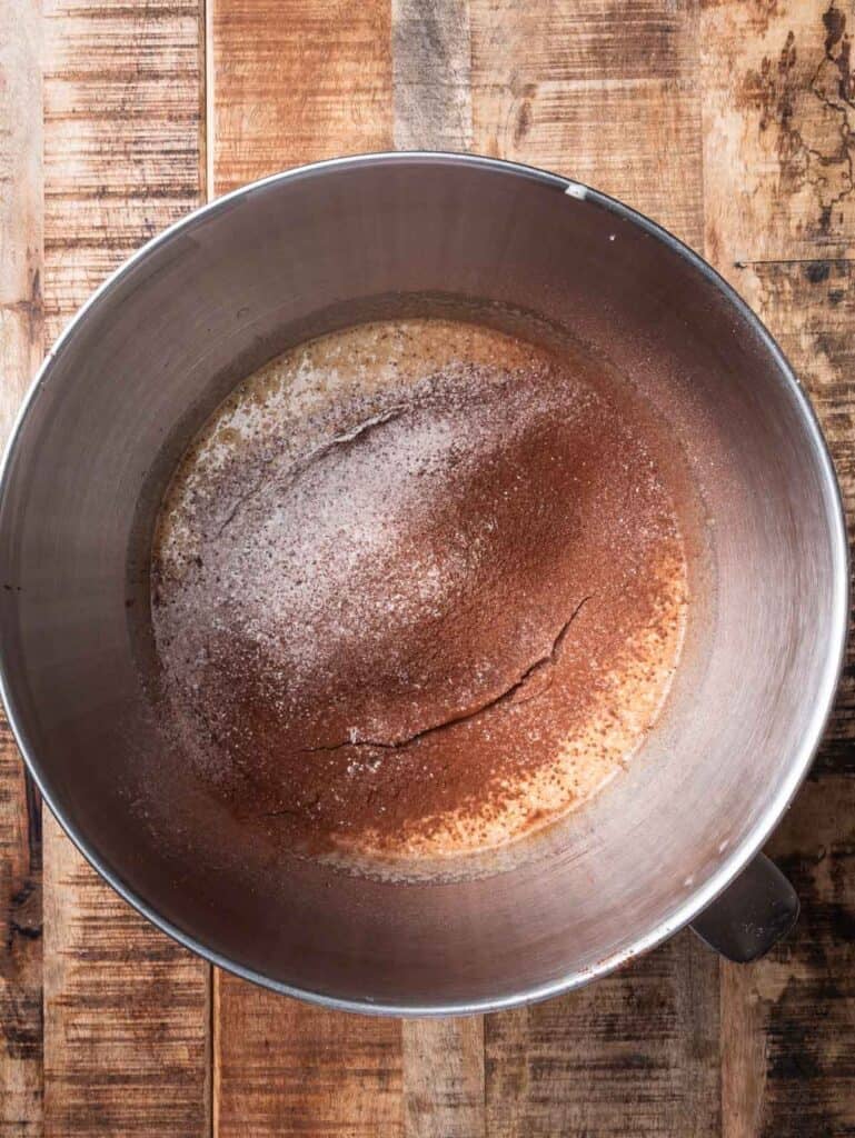 cocoa powder and flour sifted on top of sugar egg mixture.