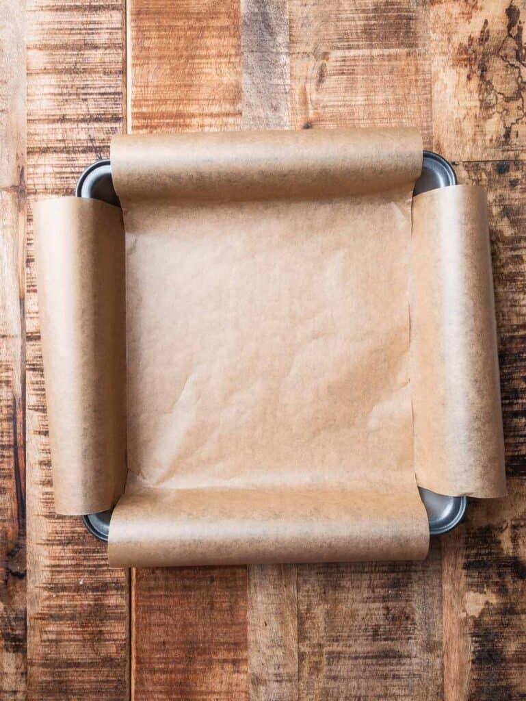 a 9-inch square baking pan lined with parchment paper.