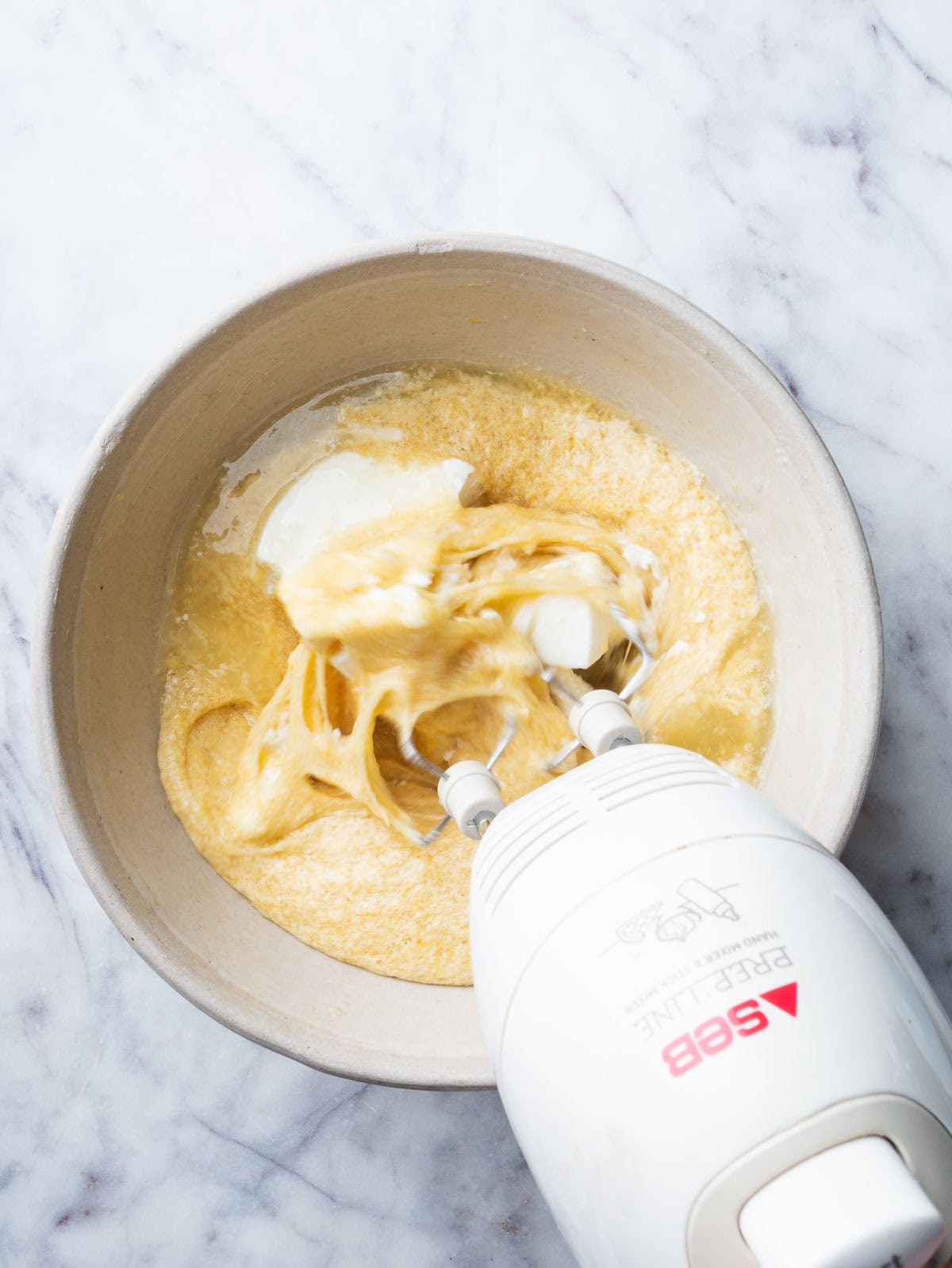 whisking ricotta and lemon juice to cake batter.