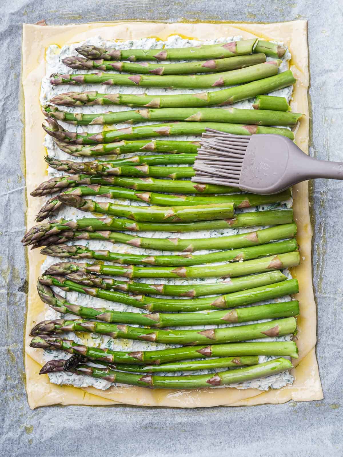 asparagus tart brushed with olive oil.