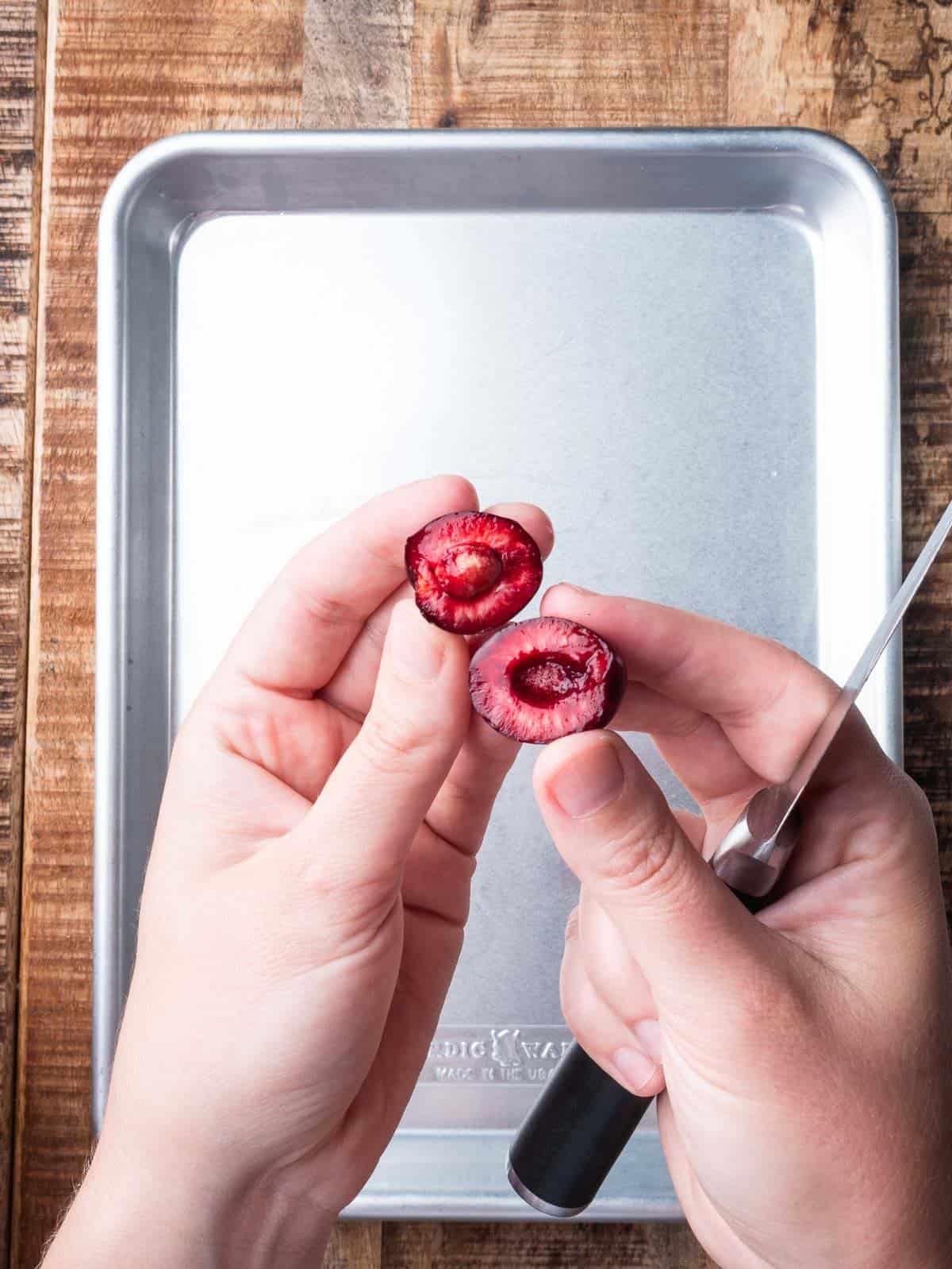 fresh cherry cut in half to remove the pit.