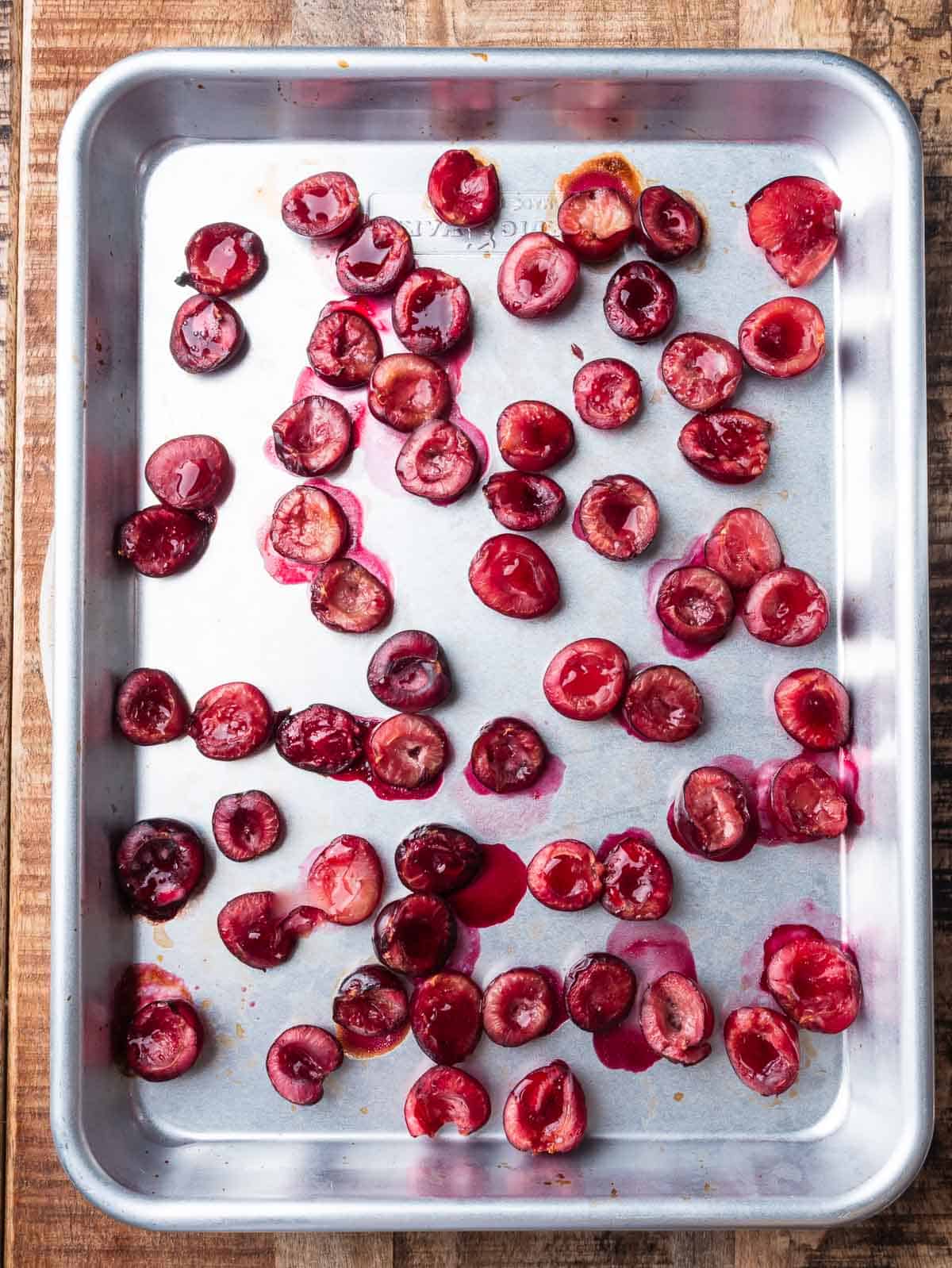 roasted cherries on a sheet pan.