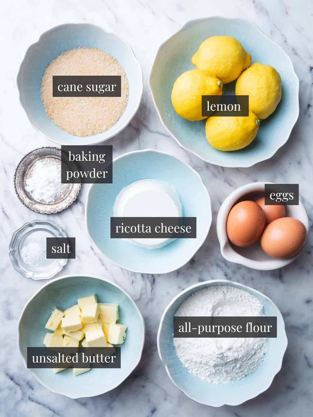 ricotta, eggs, butter, flour, salt, lemon, baking powder and cane sugar.