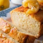 slices of lemon ricotta pound cake with the rest of the cake on a vintage blue plate.