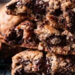pile of gooey brown butter chocolate chunk pecan cookies.