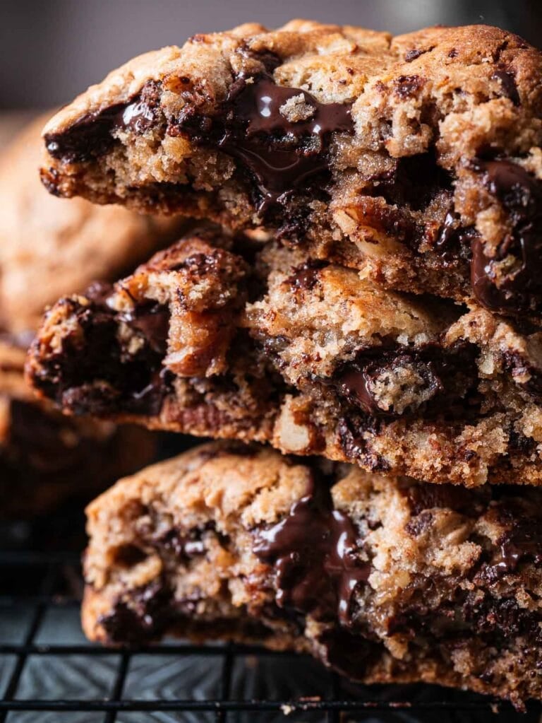 pile of gooey brown butter chocolate chunk pecan cookies.