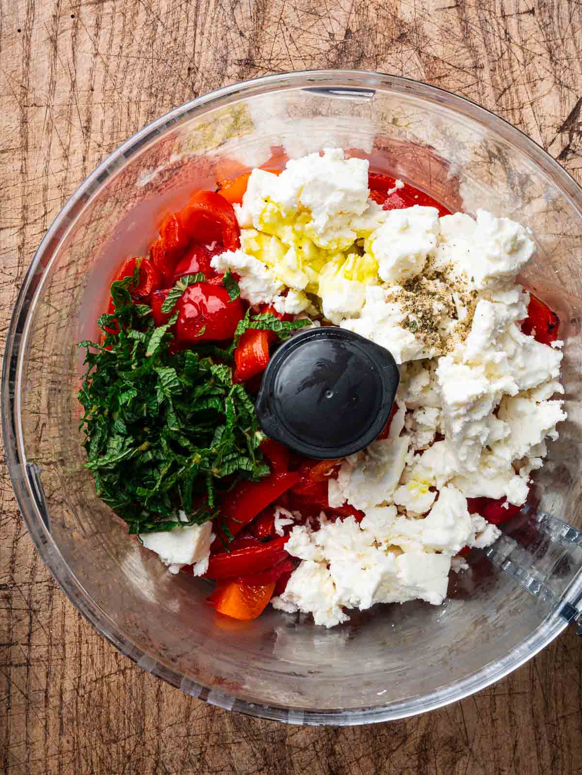 Roasted red pepper, feta, lemon juice, chopped mint, olive oil and pepper in a food processor.