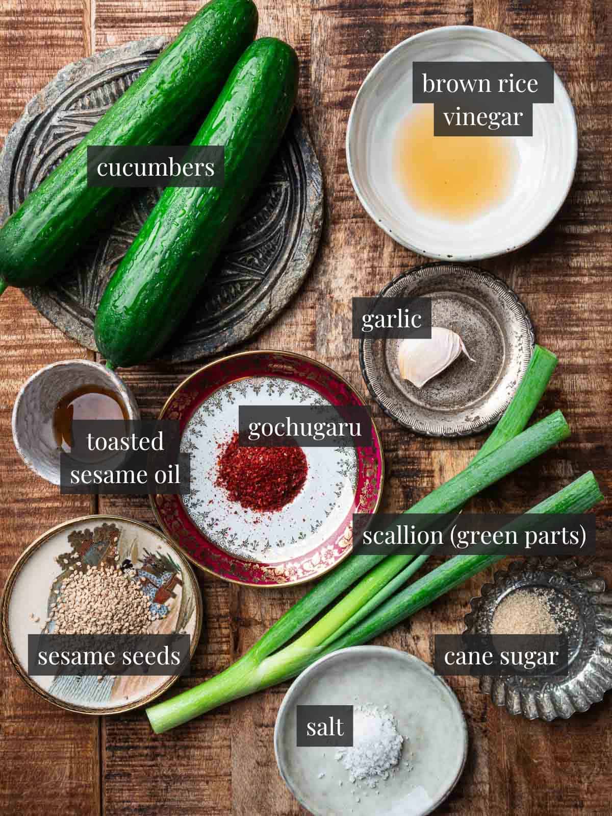 cucumbers, garlic, brown rice vinegar, gochugaru, sesame oil, scallions, sugar, sesame seeds and salt.