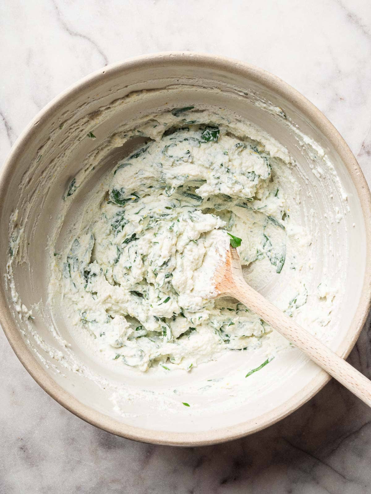 Ricotta lemon basil filling ina bowl.