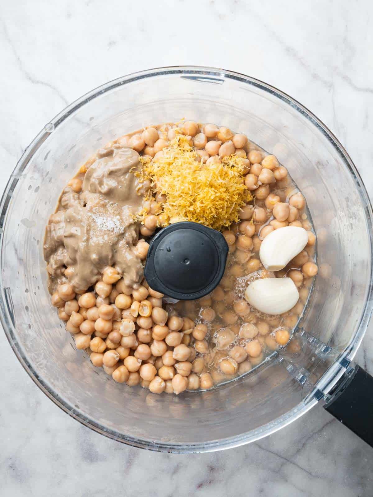 Chickpeas, lemon zest, garlic, lemon juice and salt in a food processor.